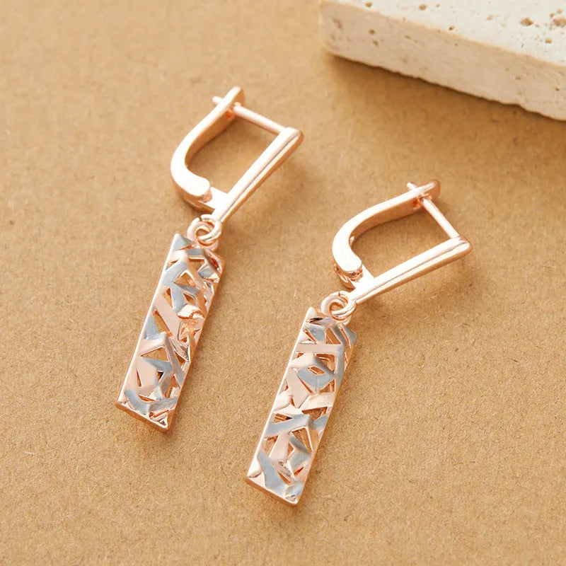 Rectangular hollow stud earrings with a two-tone picture style finish.