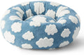 Round blue and white plaid dog bed with a removable cover on a plastic base