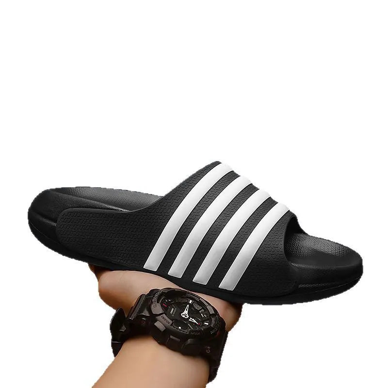 A pair of casual unisex slippers with a PVC upper and EVA sole, shown in a selected colour.