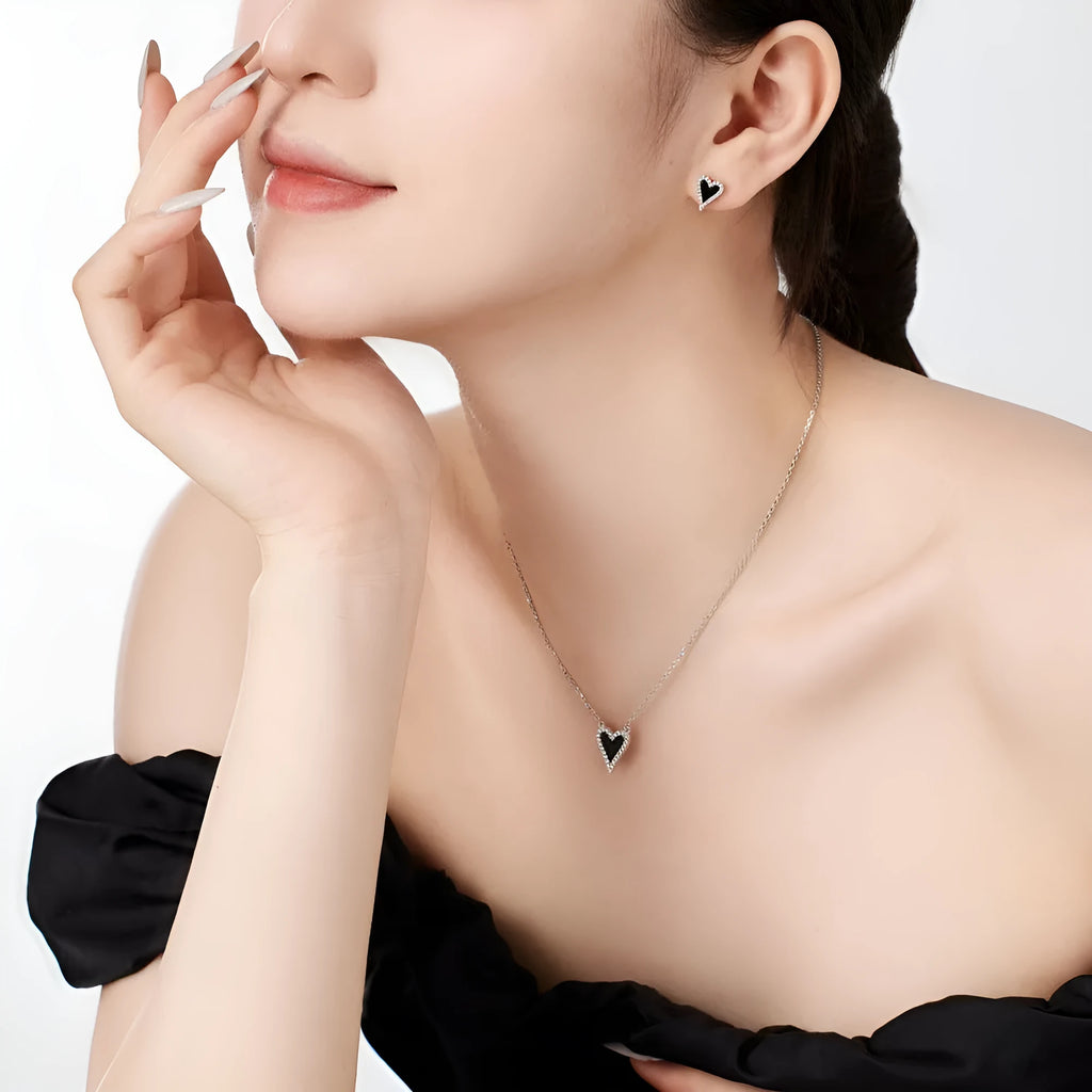925 silver black agate heart-shaped stud earrings cold wind style on white background