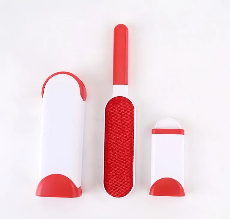 Blue reusable pet hair removal brush with sticky flannel head placed in its self-cleaning base.