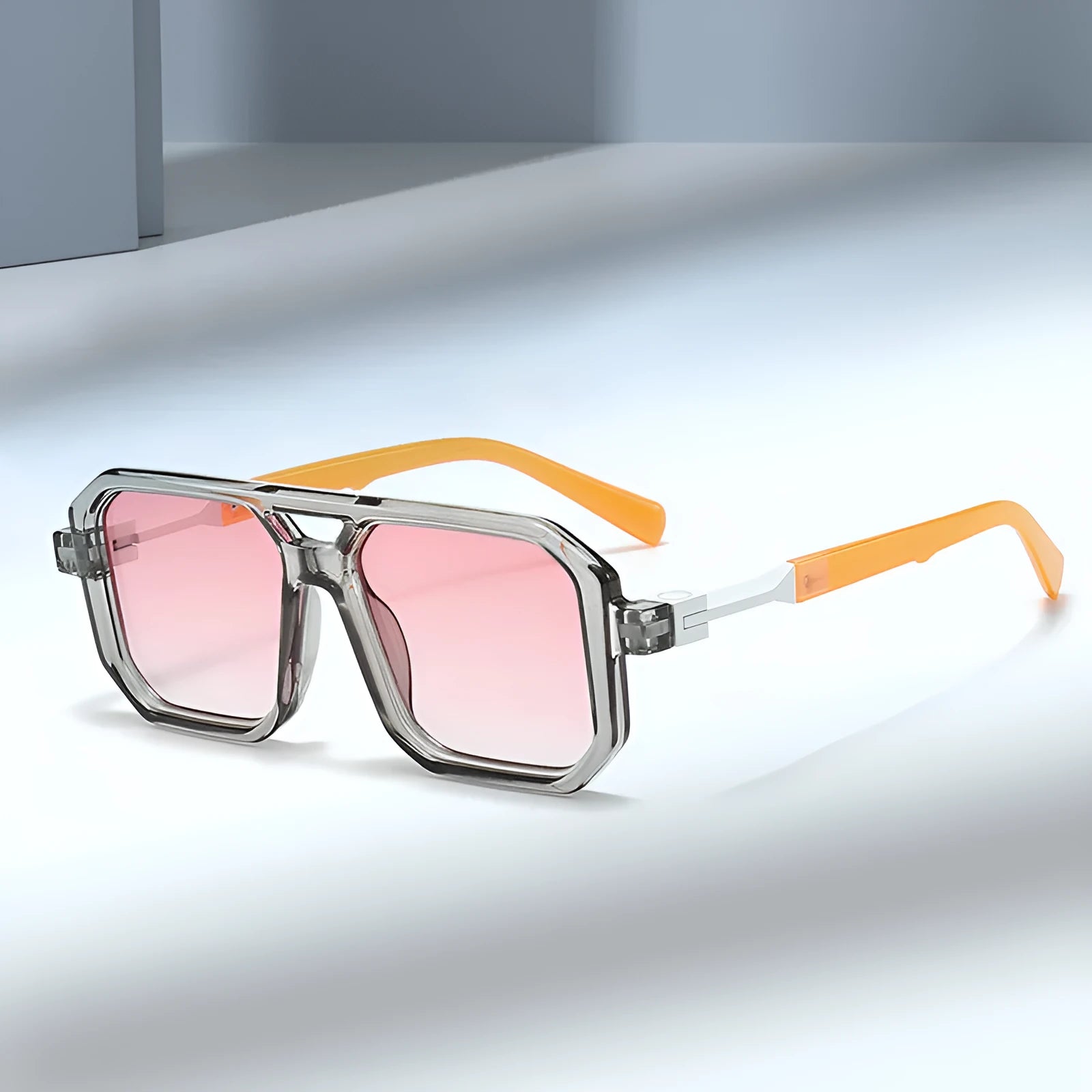 Retro double beam pilot sunglasses shown in a selection of colours including black frame with grey lenses and leopard print.