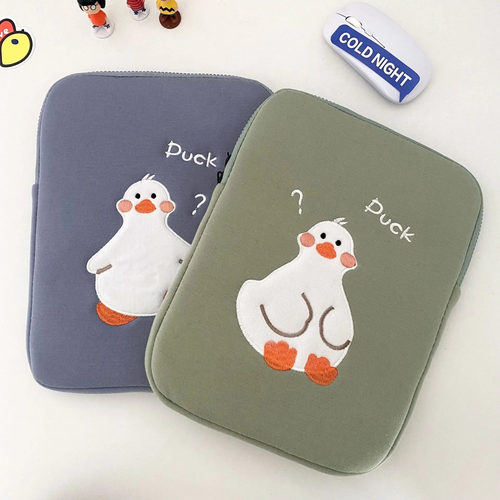 Blue cotton tablet case with duck embroidery design and zipper closure for 11-inch to 16-inch tablets