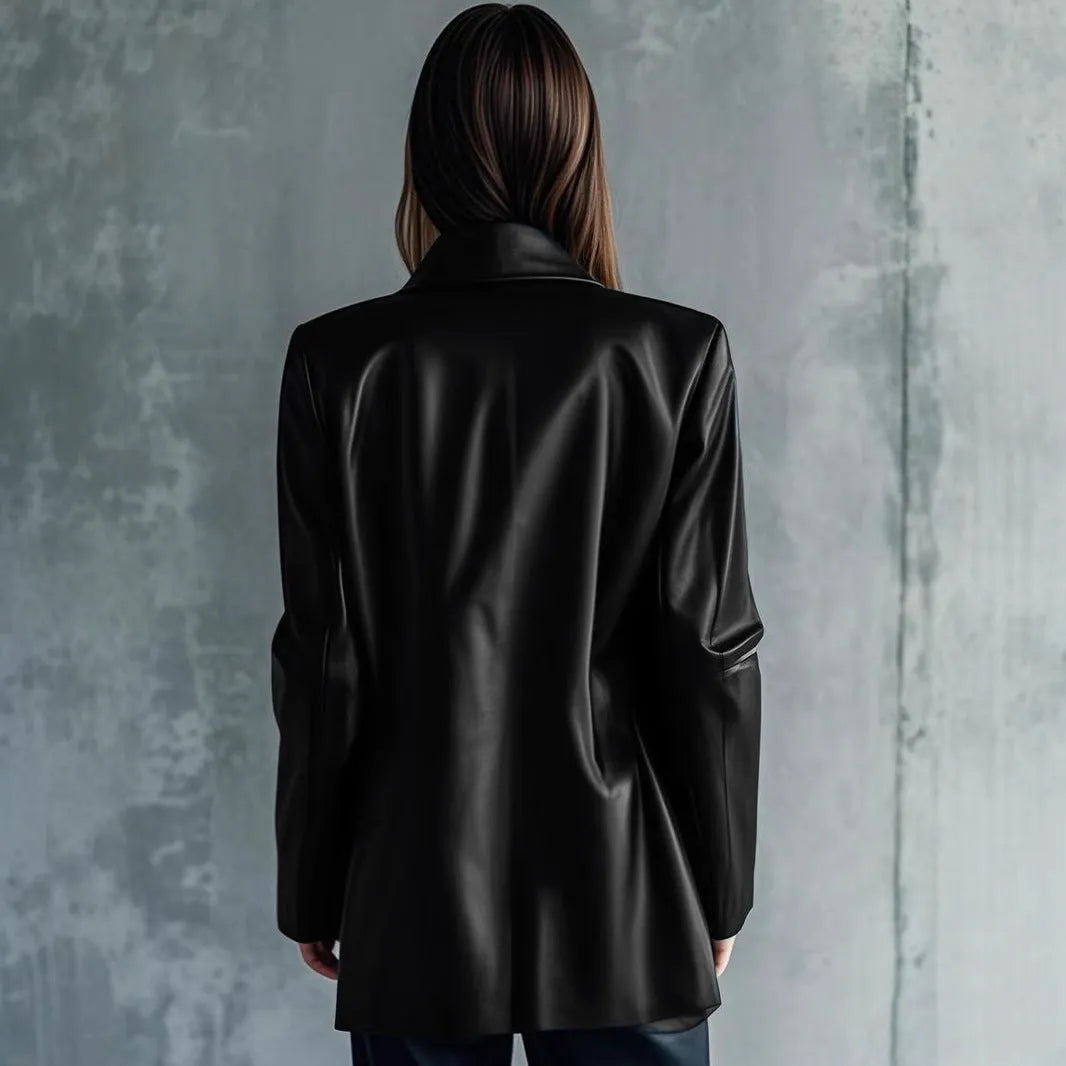 Women's solid black medium-length leather jacket with long sleeves laid flat.
