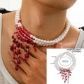 Men's Halloween necklace with red and black crystal blood drop pendant and pearl tassels on an adjustable chain