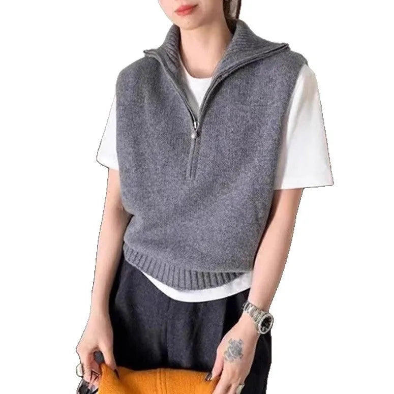Retro half-zip sleeveless knitted vest in mesh polyester shown in a solid colour with a 3D texture.