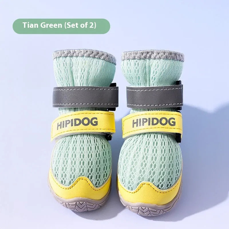 Cartoon-style blue and green PU dog shoes for summer, showing breathable anti-scald design