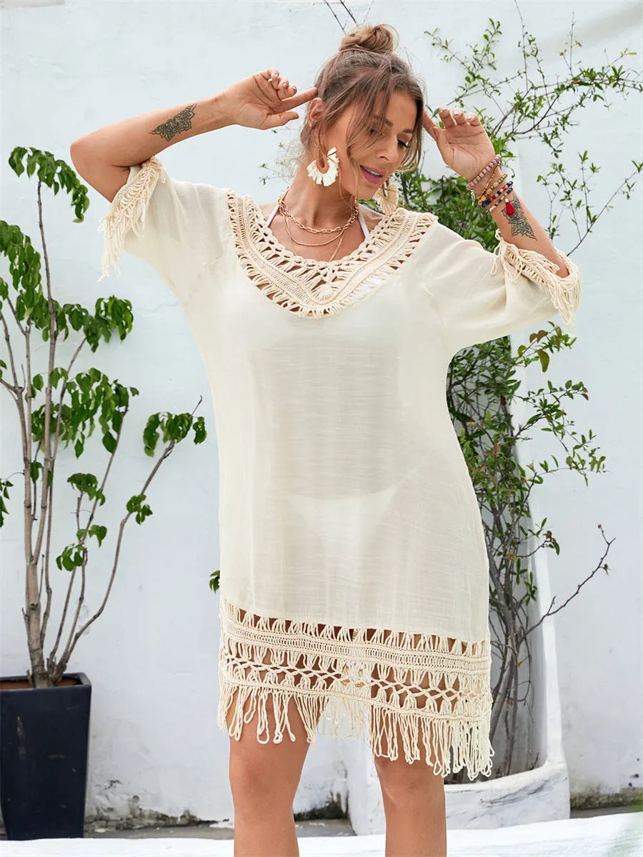 Apricot coloured hand-crocheted women's beach dress with a lining, shown on a model.