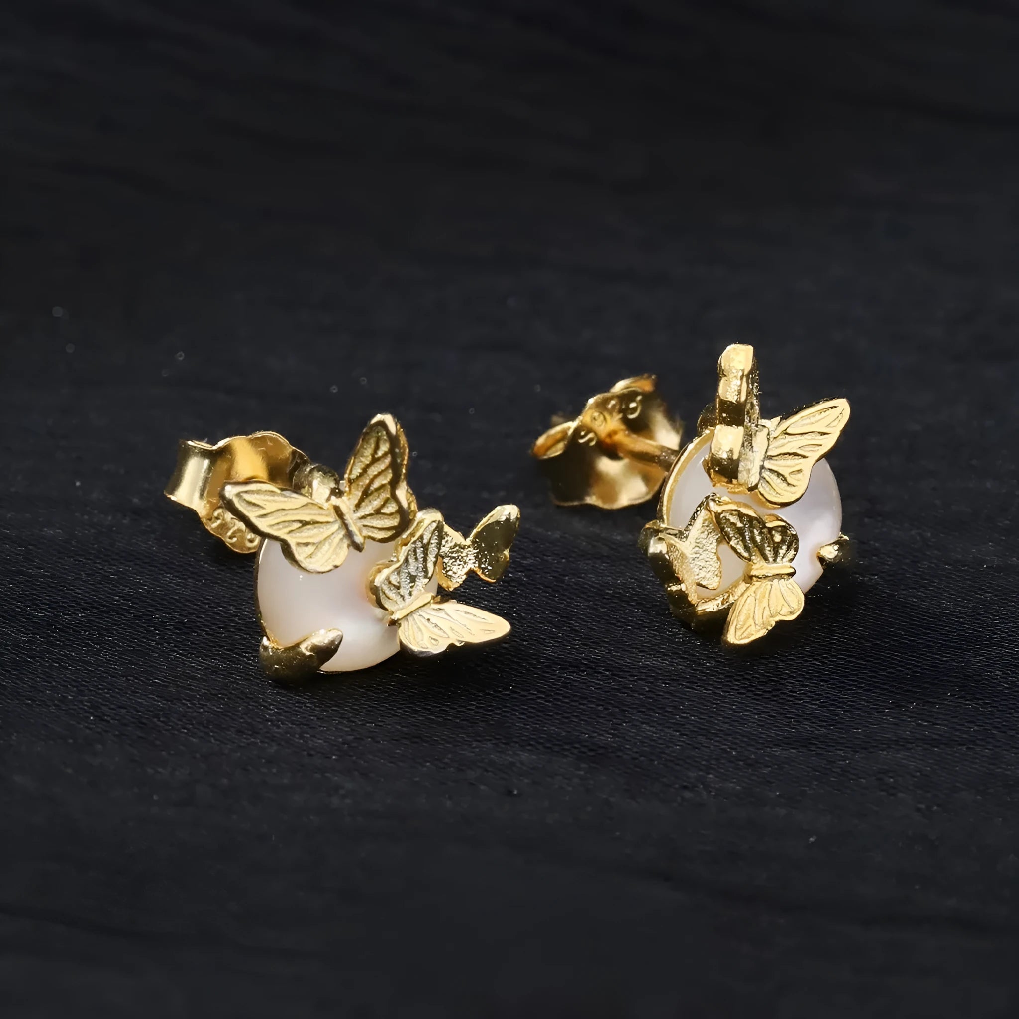 Butterfly ear studs in 925 silver with electroplated white gold or gold colour and original design