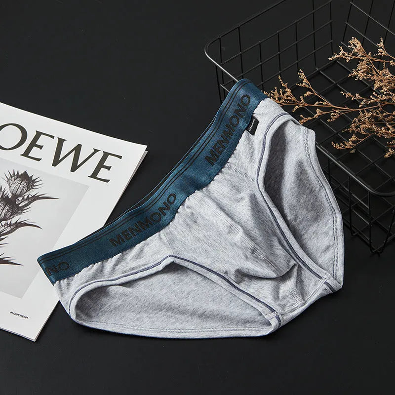 Men's solid colour cotton low waist briefs on a white background.