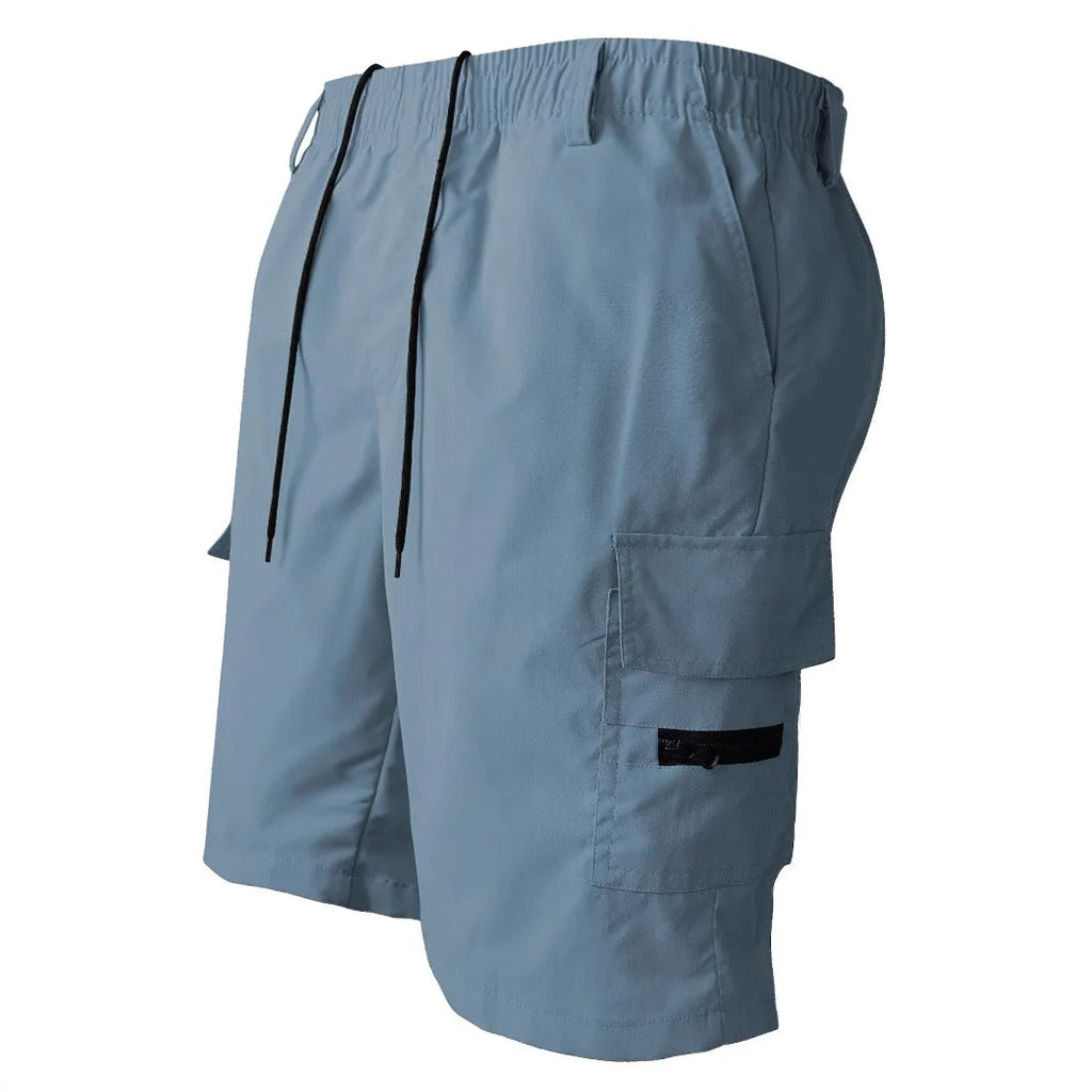 Loose straight-cut casual sports shorts in polyester, shown in khaki colour on a hanger.