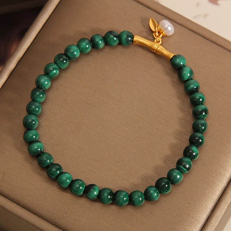 Women's adjustable lucky bamboo bracelet with white crystal detailing on wrist