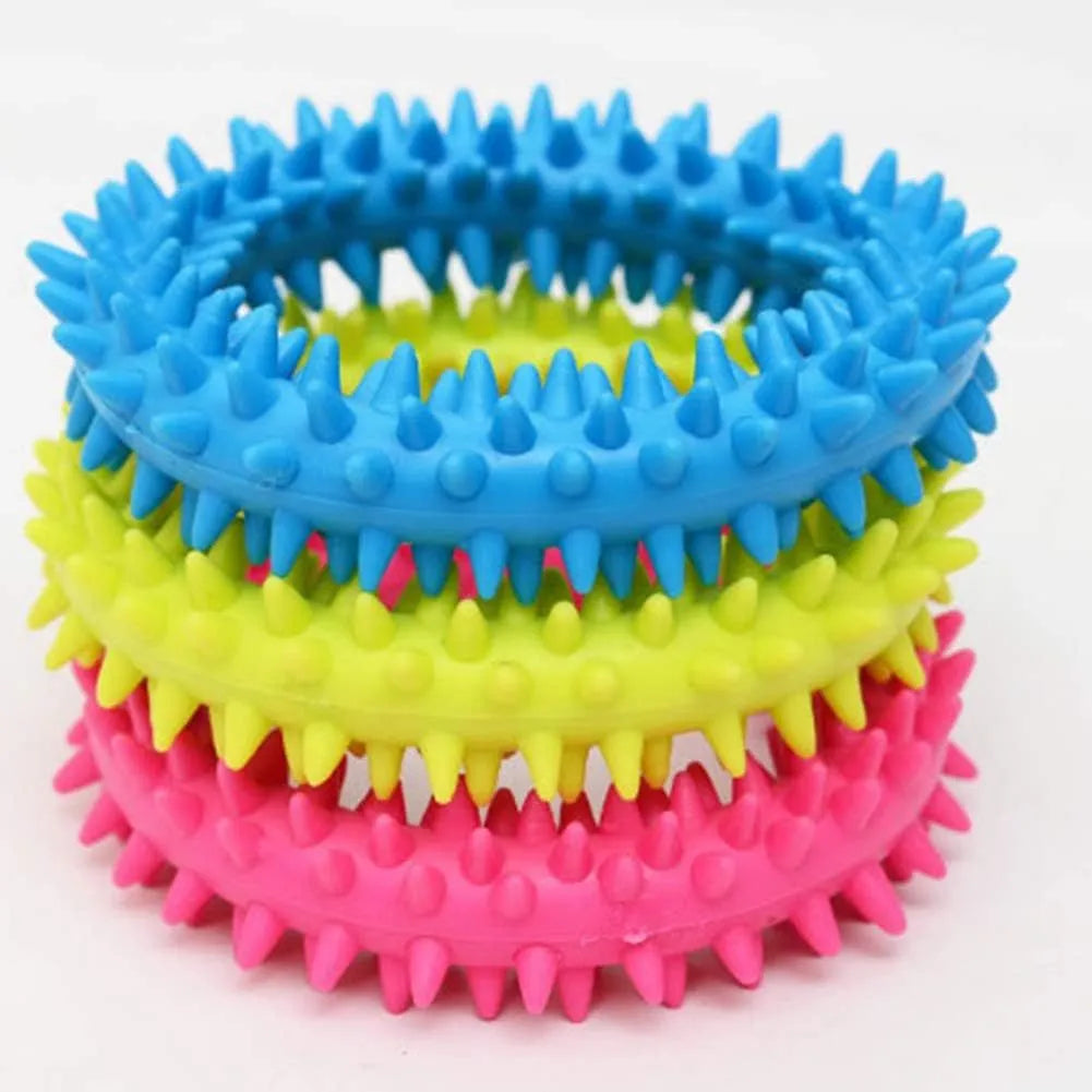Blue spiky TPR ring dog chew toy for dental cleaning on a white background