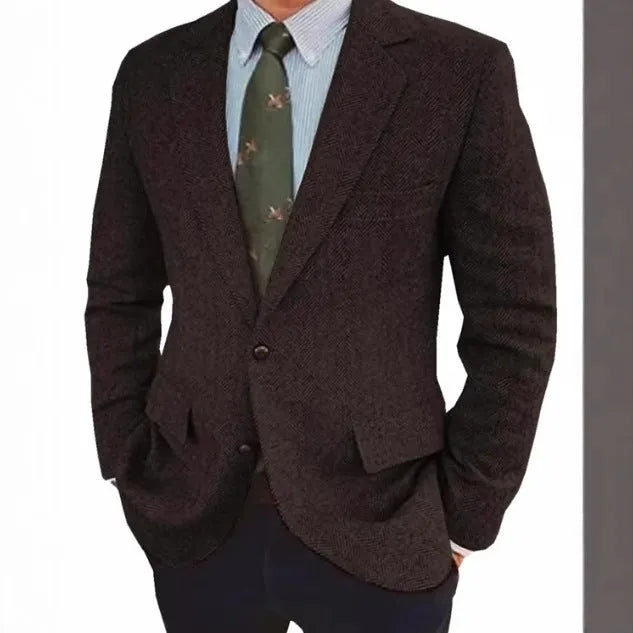 Man wearing a brown herringbone pattern retro suit jacket with a long sleeve cut.