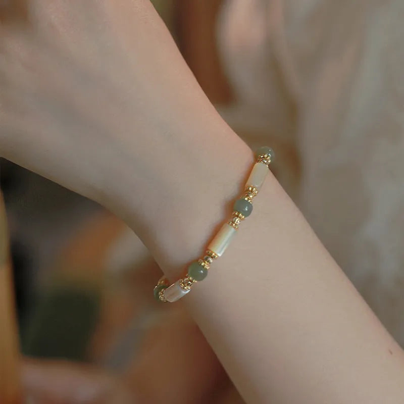 Handmade Hetian Jade white lip shell bracelet with round beads in simple geometric design