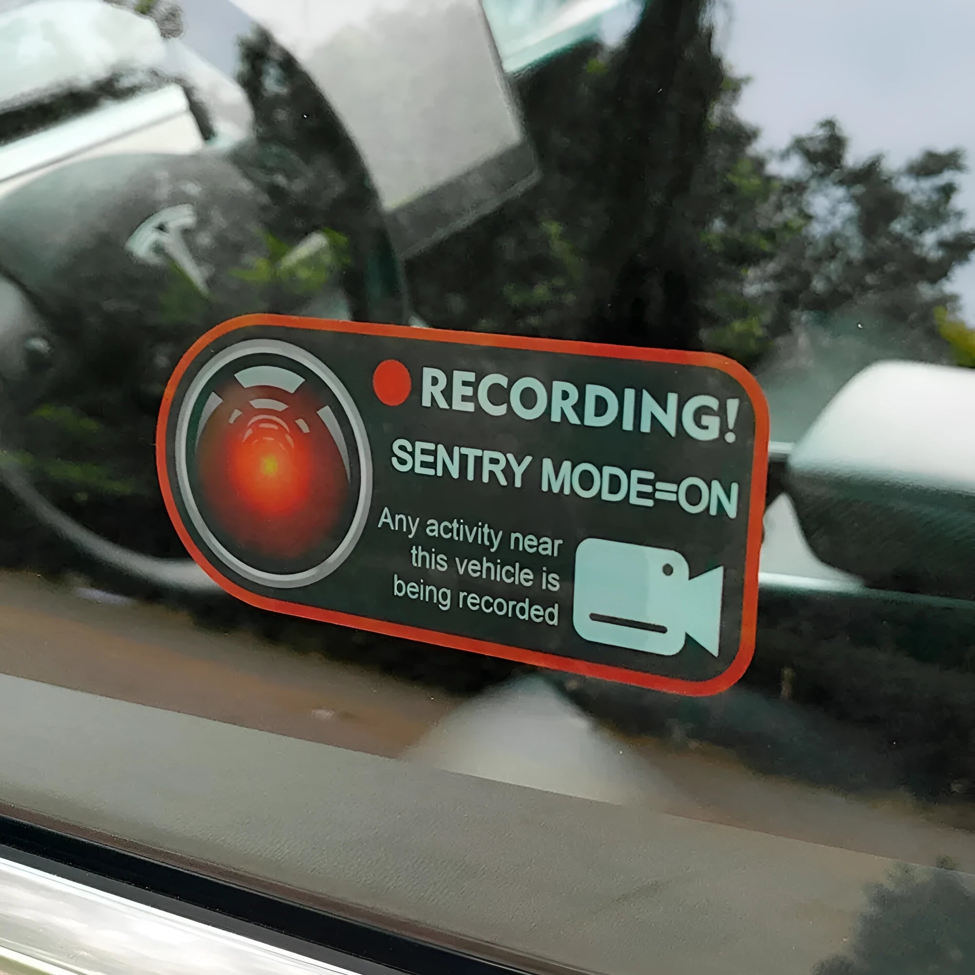 Tesla Sentry Mode warning sticker showing English text on electrostatic PVC material