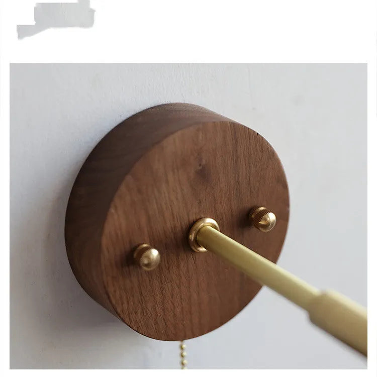 Nordic style wooden bedside wall lamp mounted on a light-coloured wall.