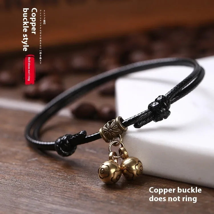 Adjustable nylon rope dog collar with a brass bell, shown in black, red, and coffee colour options.