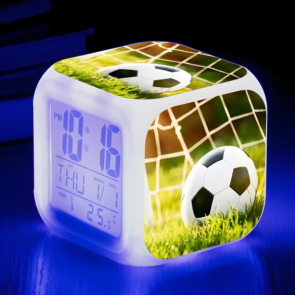 Cartoon football pattern silent alarm clock for children on a desk.