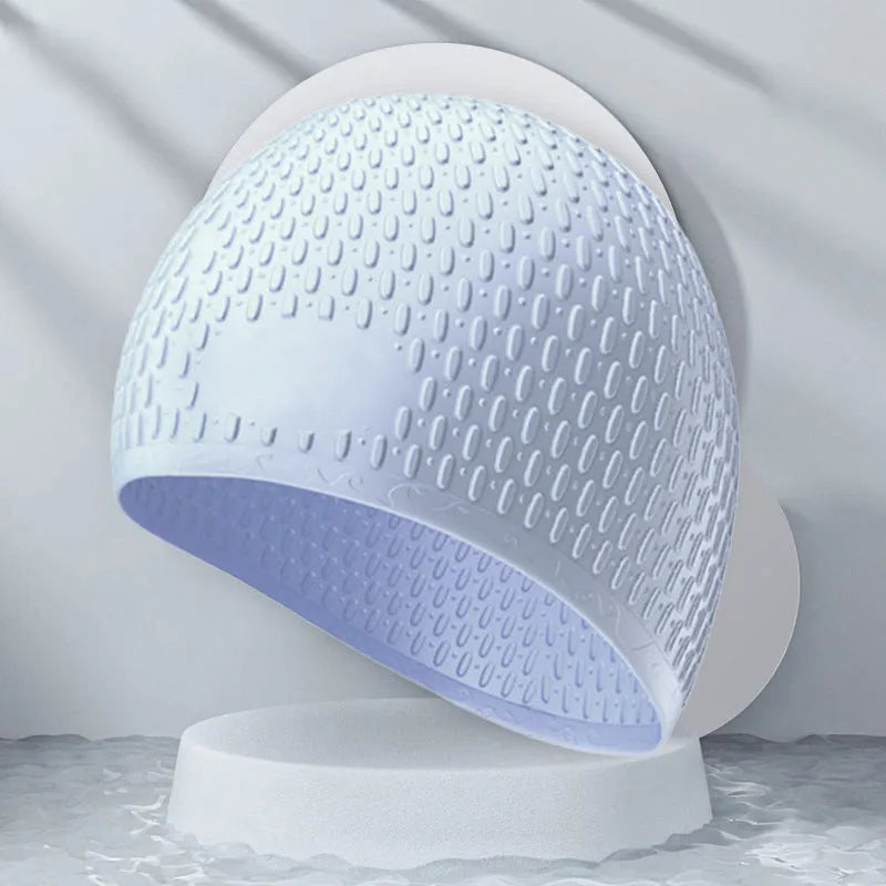 Solid colour silicone swimming cap for adults shown in multiple fashion colours.