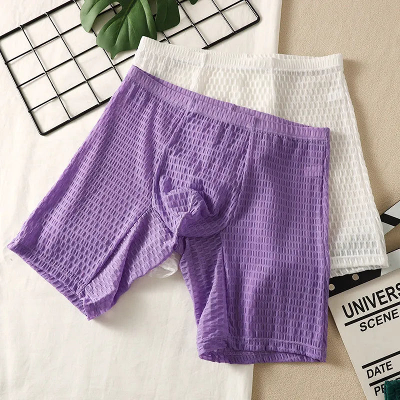 Men's lace fabric boxer shorts in light purple with a lengthened hip lifting shaping design.