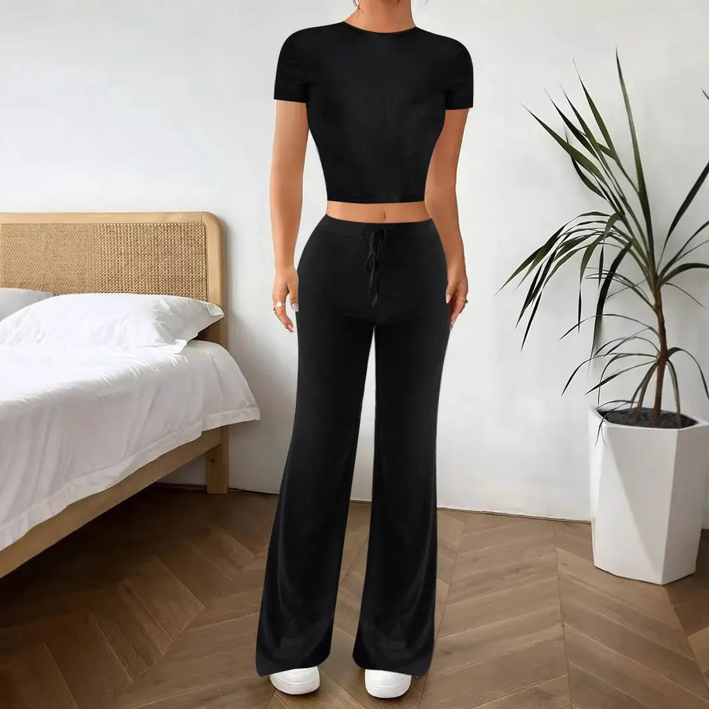 Black polyester trouser suit set with high-waisted trousers and short sleeve V-neck top