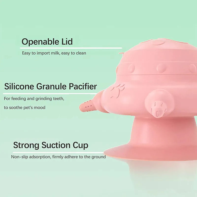 Pink silicone pet milk feeder with four nursing nipples for puppies and kittens on a flat base.