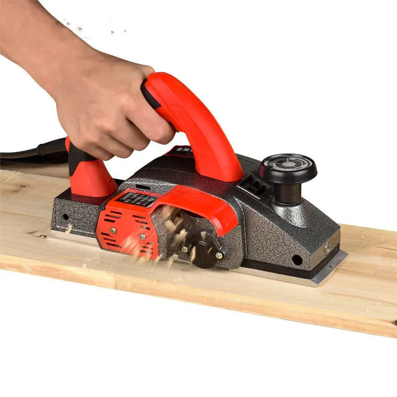 Red desktop electric wood planer with 82mm width and aluminium housing