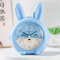 Children's cartoon style singing alarm clock with mute function and night light in blue or pink