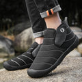 Men's waterproof snow boots in black with non-slip rubber soles and artificial plush lining