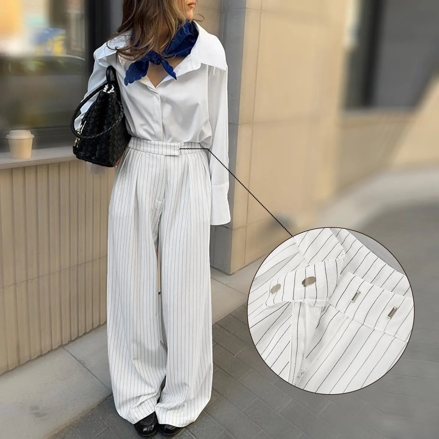 White women's wide-leg trousers with a stripe detail and zip fastening, laid flat.
