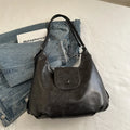 Leather women's shoulder bag in brown colour with single strap and structured horizontal design