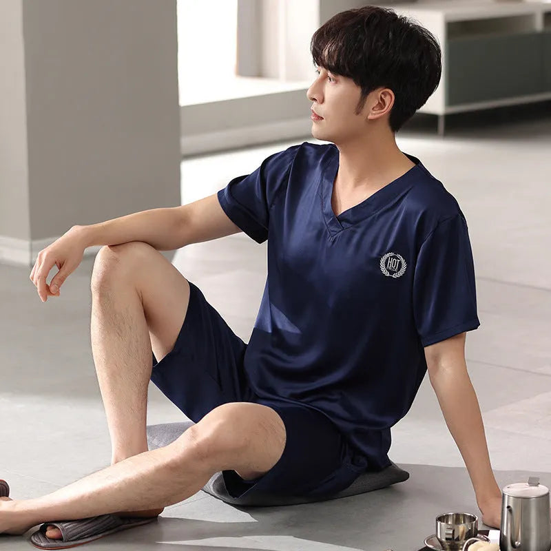 Man's ice silk pajama set showing loose short sleeve shirt and matching shorts in a solid colour.