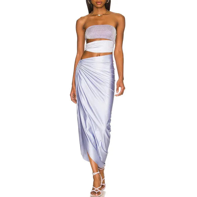 Purple one-piece swimsuit with matching wrap skirt set on mannequin