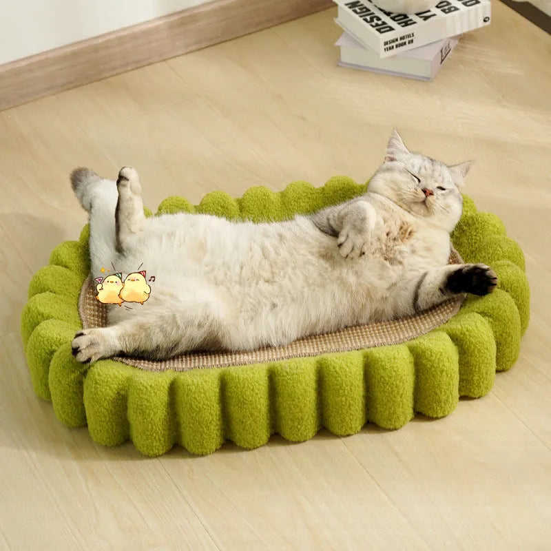 Green oval-shaped cat scratching pad with sisal fabric, serving as a lounge bed for cats.