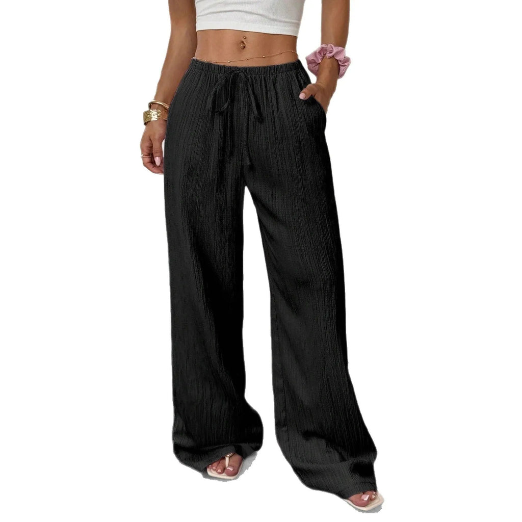 Women's black wide leg trousers with lace-up waist trimming detail on mid-waist