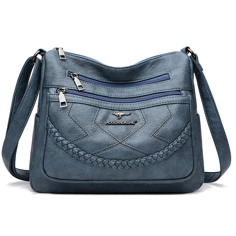 Soft PU leather women's shoulder bag with crossbody strap in black colour