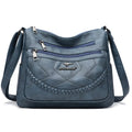 Soft PU leather women's shoulder bag with crossbody strap in black colour