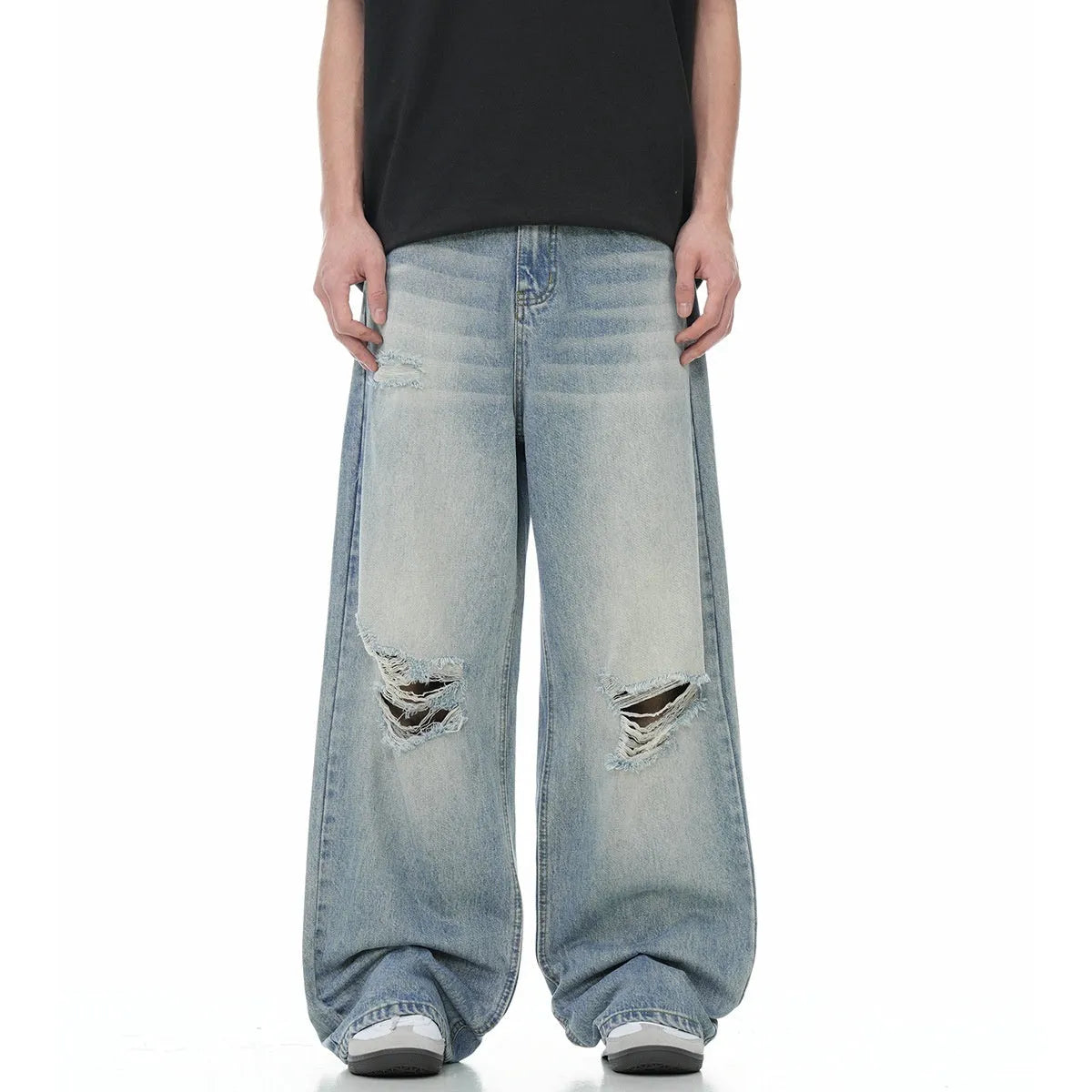 Blue men's straight-leg ripped jeans on a neutral background, showing the cotton blend fabric and zipper fly detail.