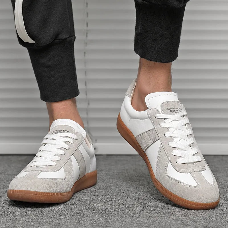 White retro unisex sneakers with round toe and lace-up front