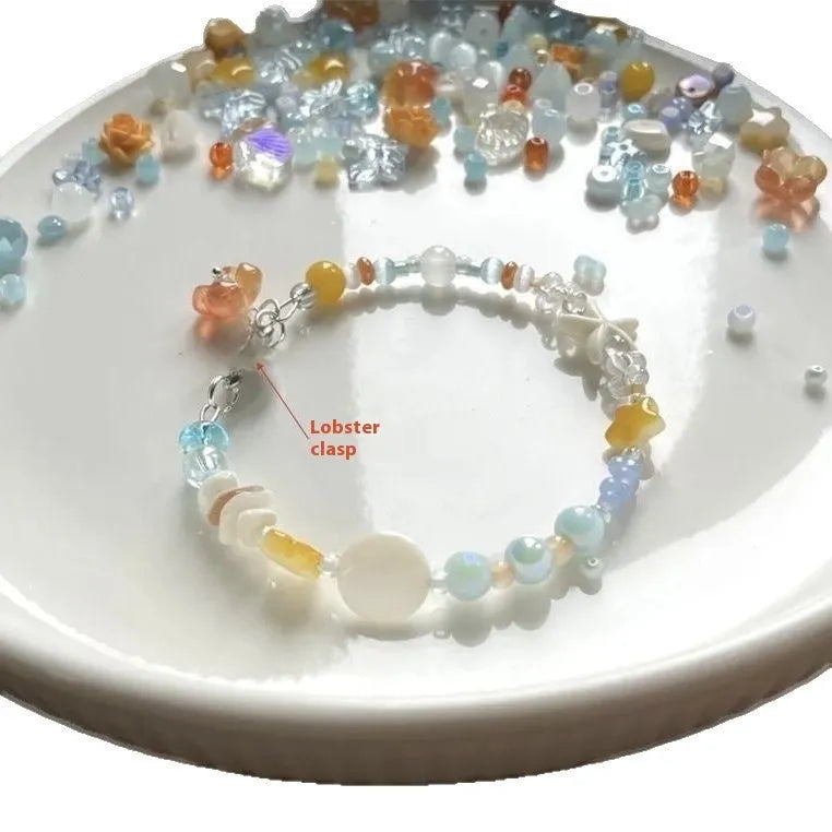 Orange mixed material women's bracelet with diamond shape and round decorative elements