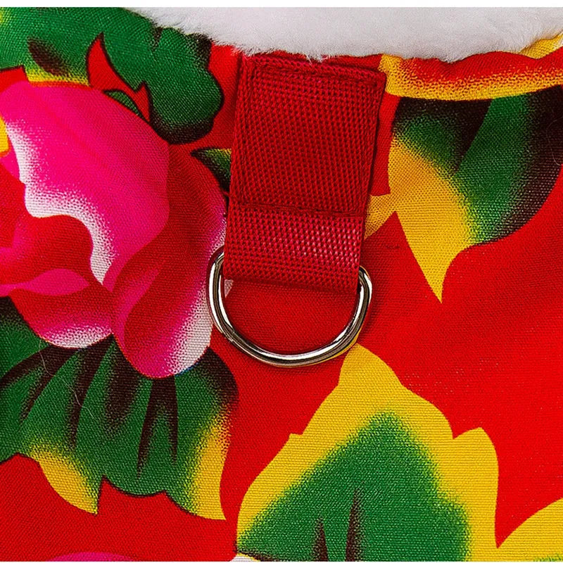 Red winter dog vest with plush lining, metal D-ring, and large floral peony pattern on a small dog