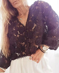 Women's loose black polyester lace cardigan with V-neck and 3D lace flower decoration.