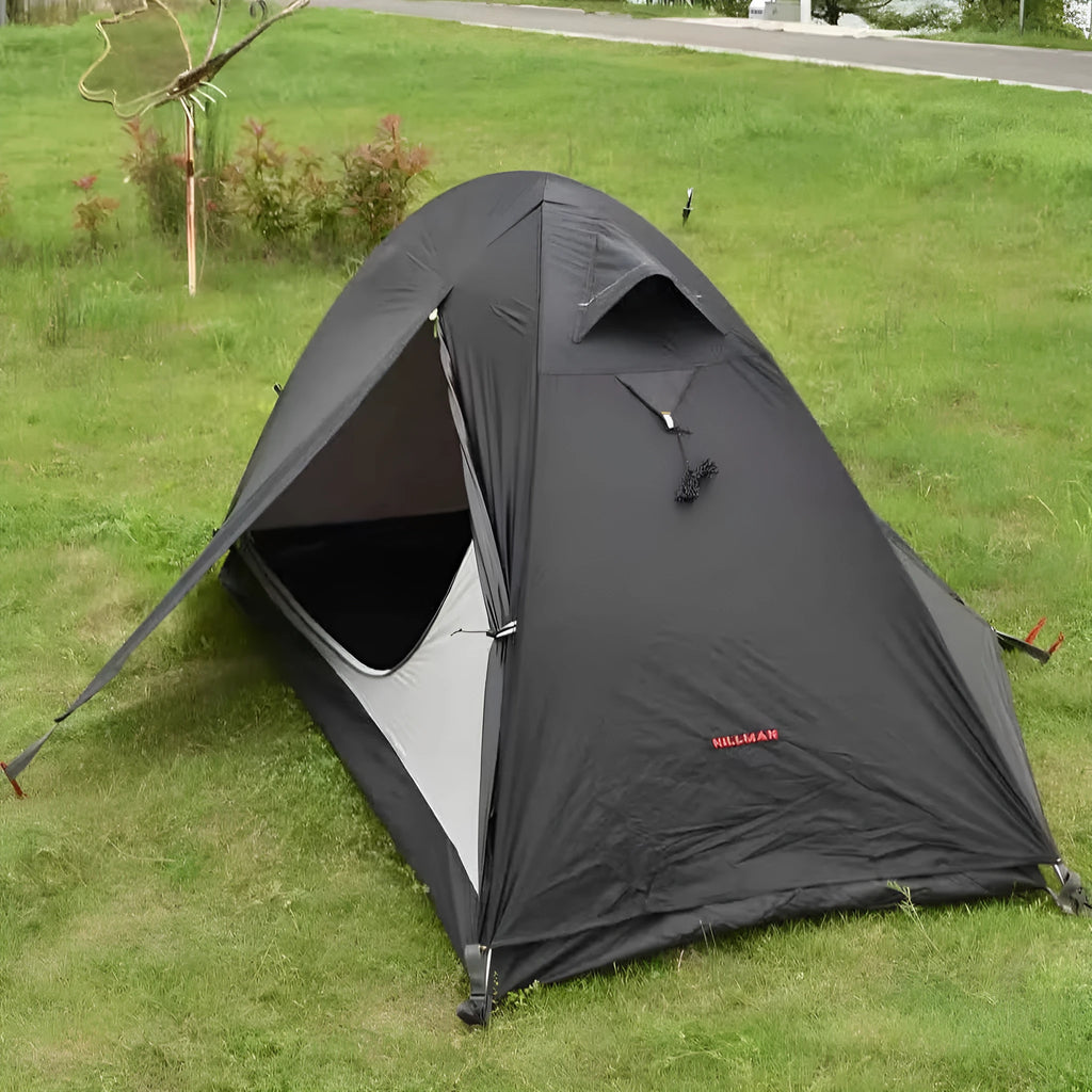 Single person double skin tent with aluminium poles in a red colour option, shown erected.