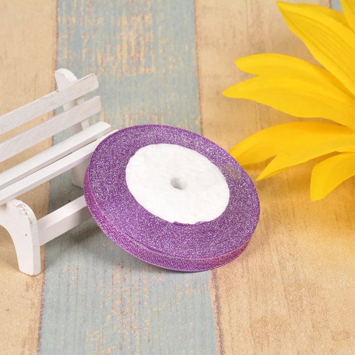 Green onion coloured polyester ribbon with gold polka dots on 25-yard spool for decorative trimming