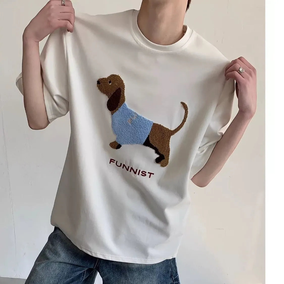 Men's grey cotton T-shirt with embroidered sausage dog holding towel design on front