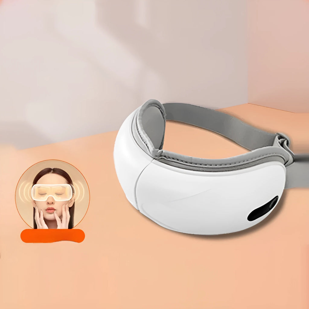 White rechargeable eye massager for hot compress and airbag massage relief