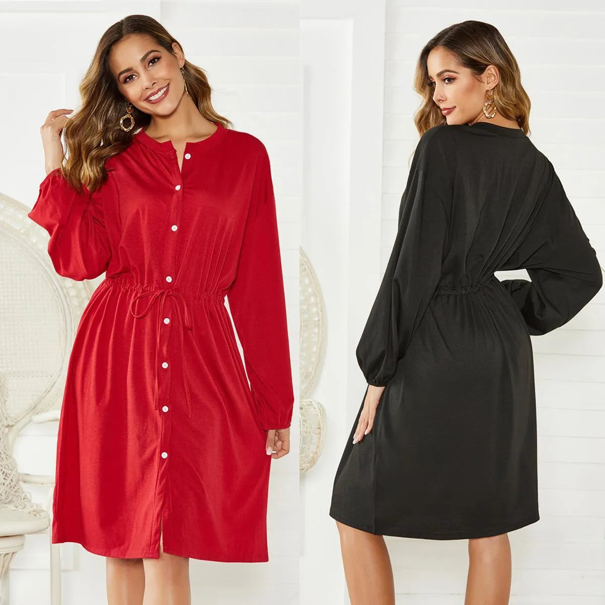 Black mid-length A-line dress with long sleeves, elastic waist, and a cinching belt laid flat.