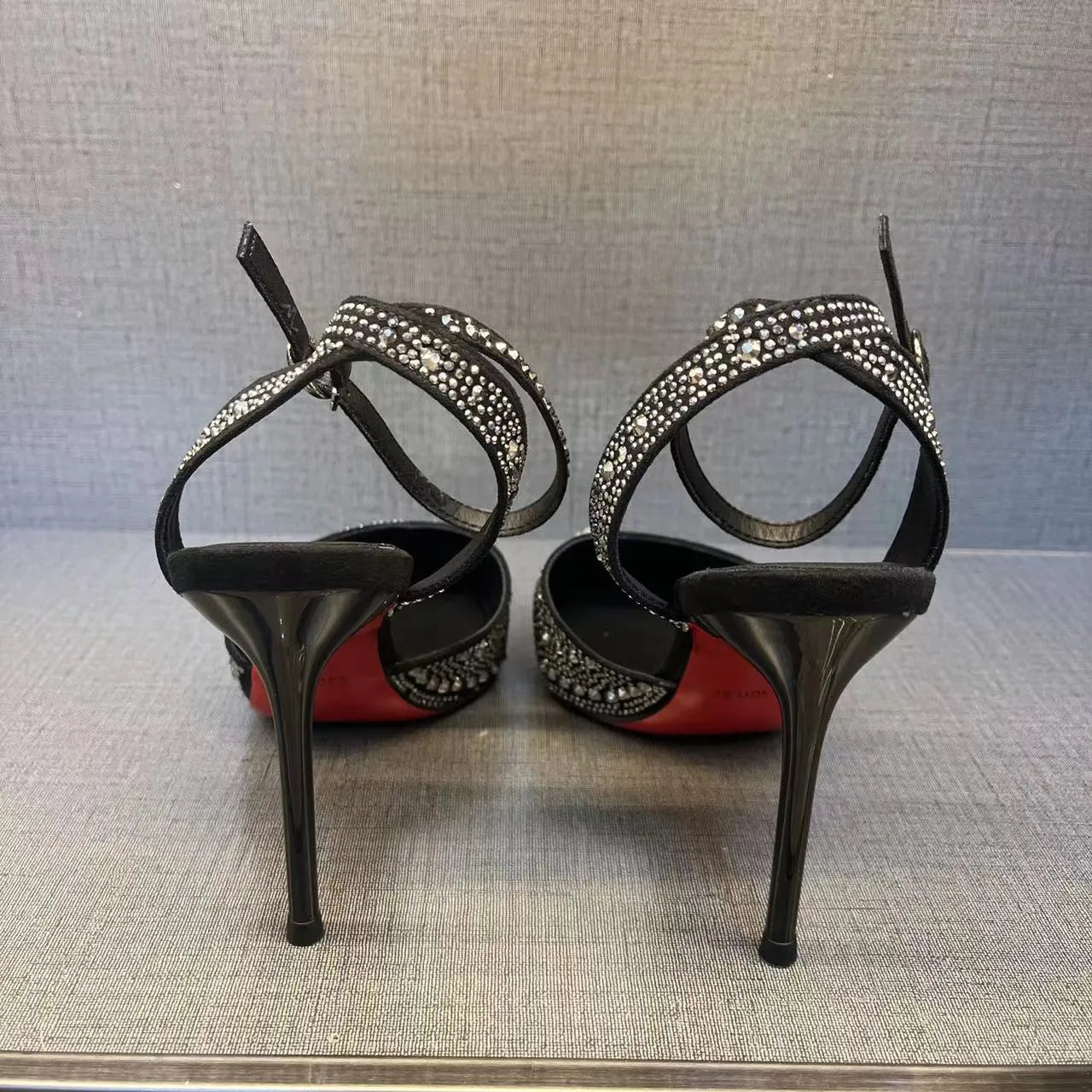 Women's hollow high heels with red sole and stiletto heel in black or silver colours