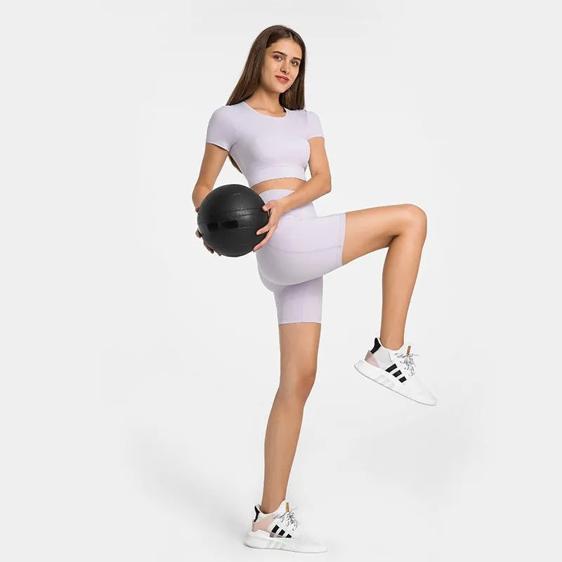 Women's black sport shorts with super stretch fabric and mid-thigh length.